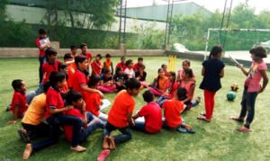 kranthi keen coaching students in playground